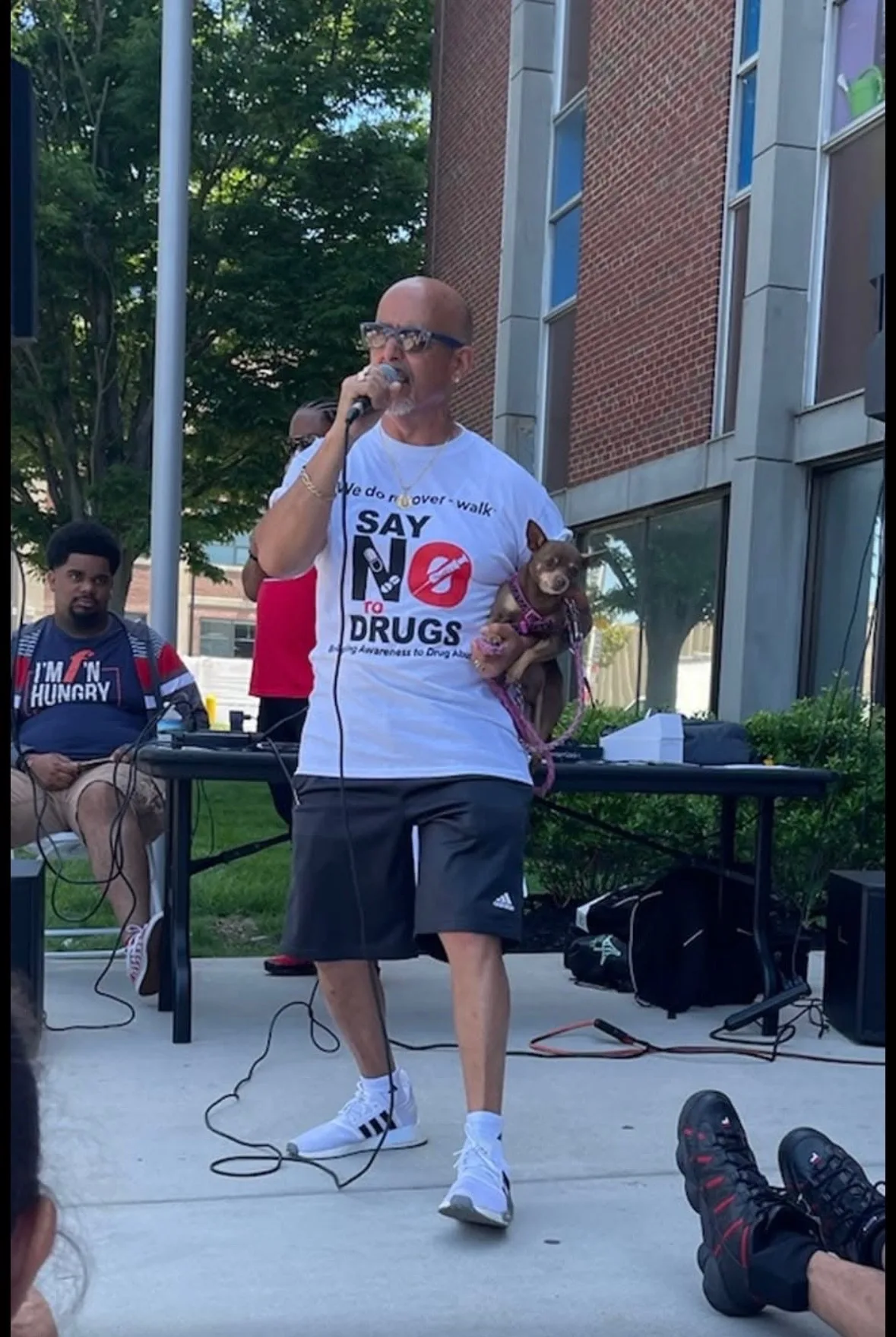 Rob G speaking at a Say No To Drugs community recovery walk with his dog