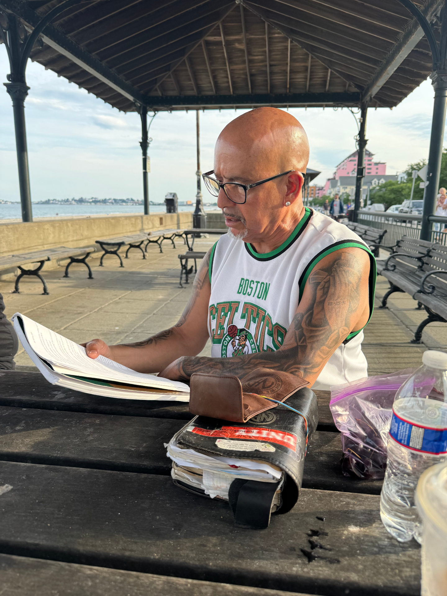 Rob G studying a well-worn recovery book, sharing the wisdom that has guided his own journey