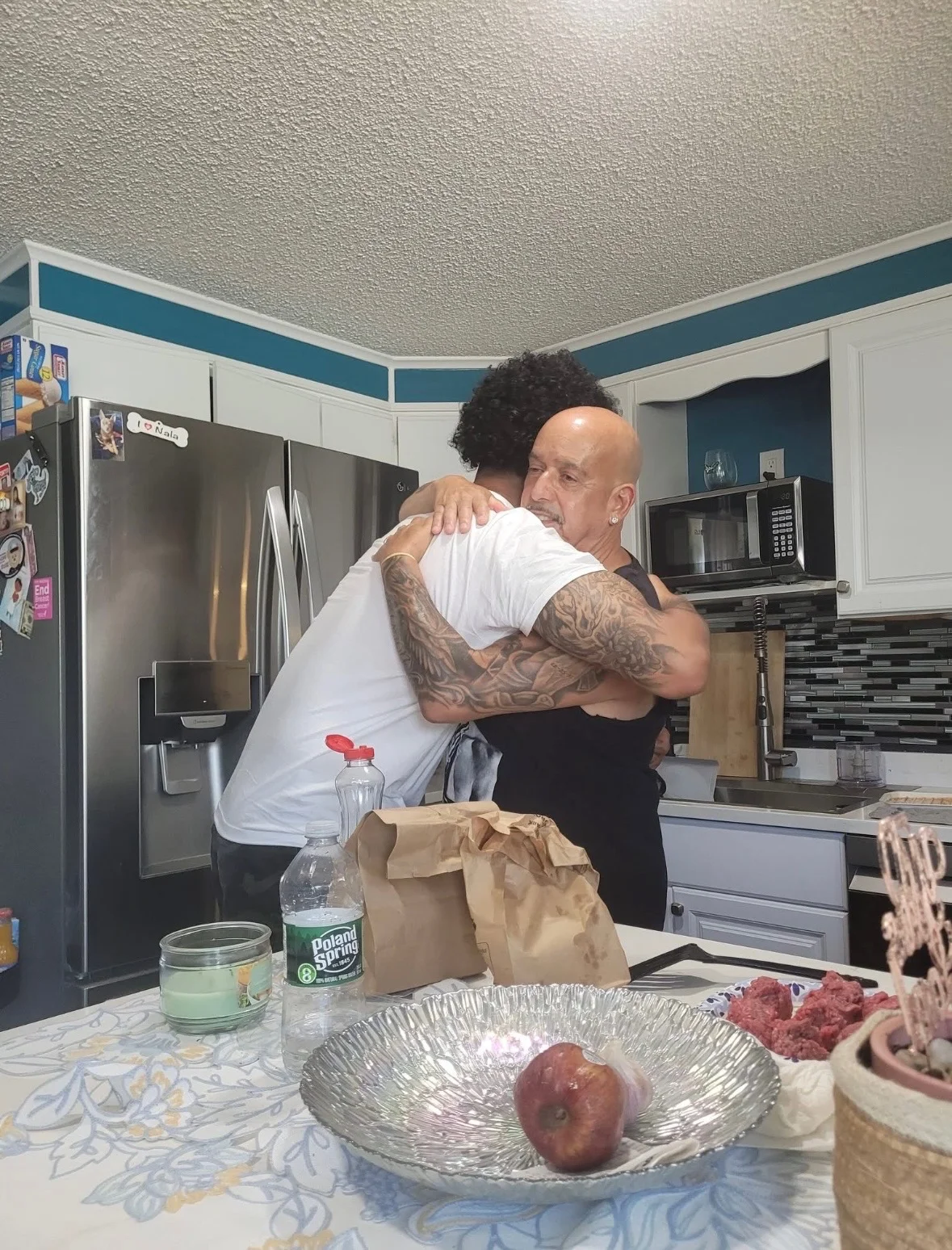 Rob G sharing a heartfelt hug with a loved one at home