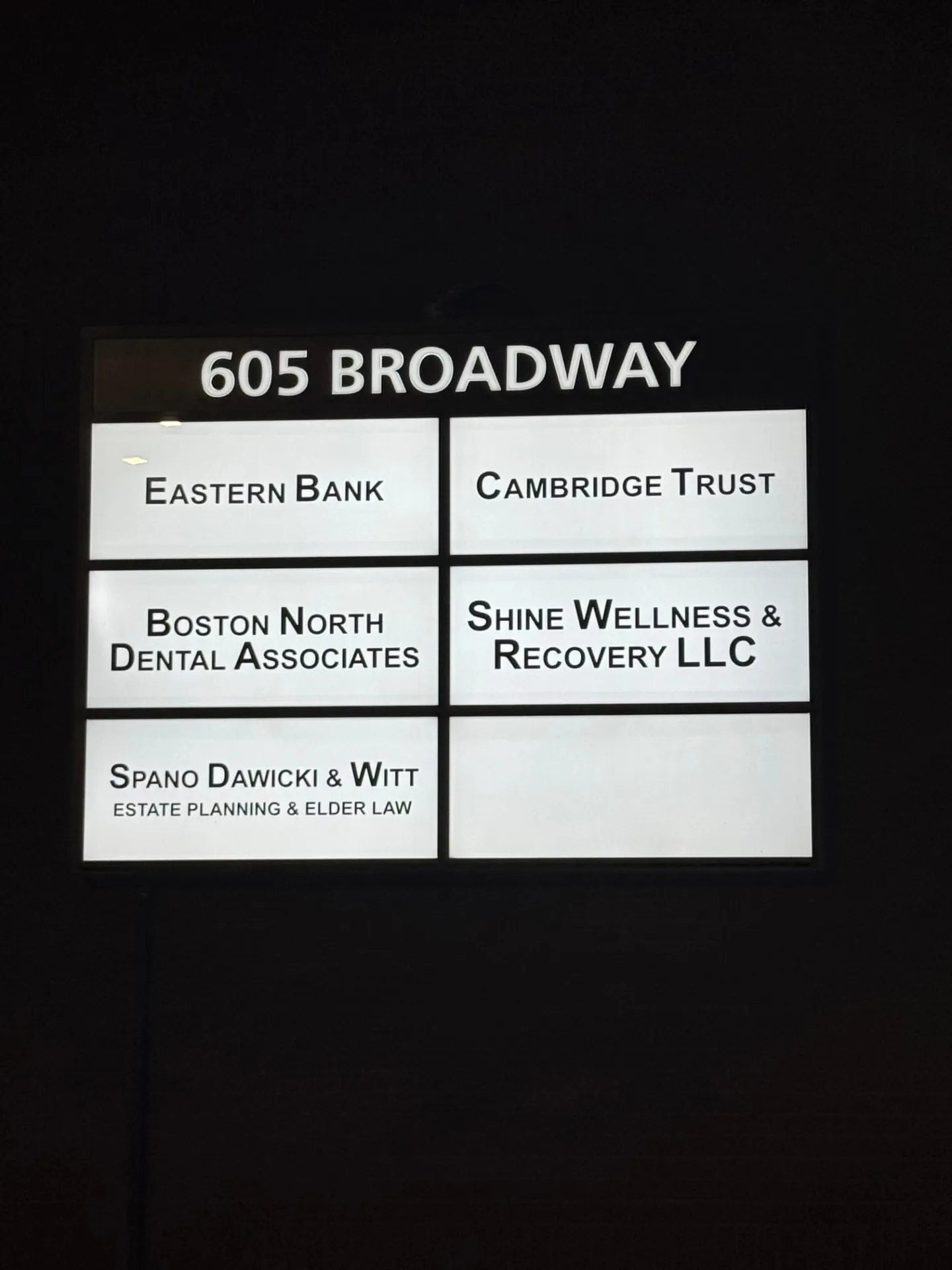 Backlit building directory sign at 605 Broadway in Saugus, MA listing Shine Wellness & Recovery LLC among the tenants
